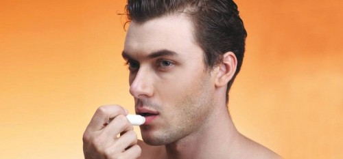 Man applying lip balm