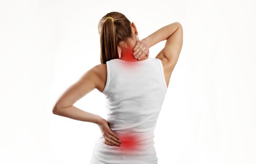 Women showing her back pain due to inflammation