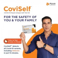 Person holding Mylab CoviSelf - COVID-19 Rapid Antigen Self Test Kit in his right hand
